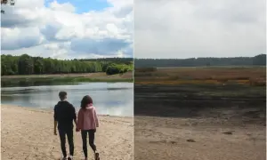 Para spaceruje po piaszczystej plaży nad jeziorem, w tle las. Po prawej stronie rozległe mokradła, tworzące dziki zwierzyniec. Trasa widokowa.